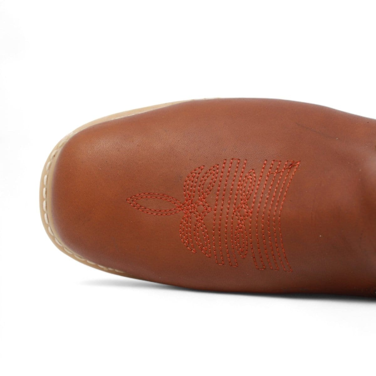 Men's square toe work boots with rubber sole in gold color by La Carreta toe view