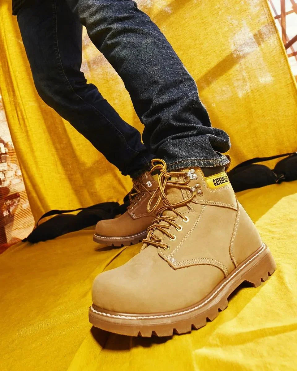 Men's Second Shift soft toe work boots in honey by CAT worn view