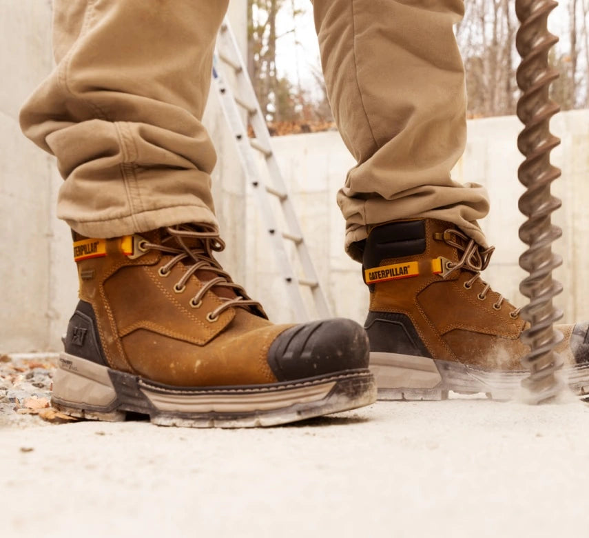 Men's 6″ Excavator waterproof composite toe work boots with Power Spring technology in pyramid sand by CAT worn view