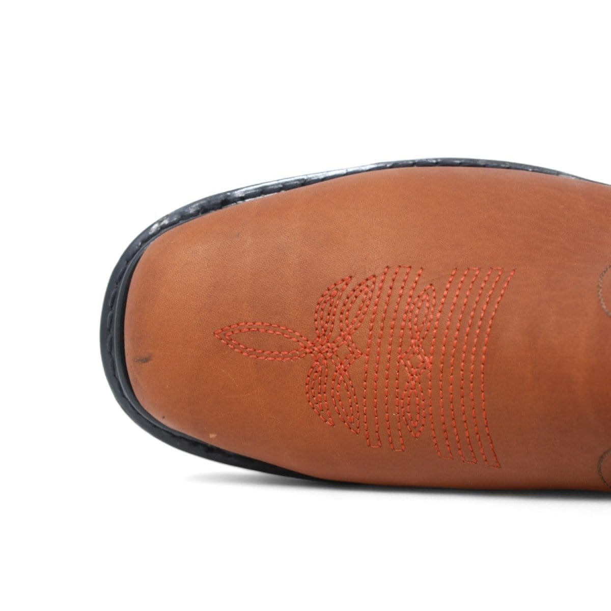 Men's square toe work boots with rubber sole in gold color by La Carreta toe view