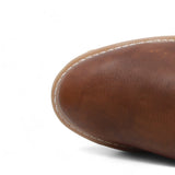 Men's round toe work boots with rubber sole in gold color by La Carreta toe view